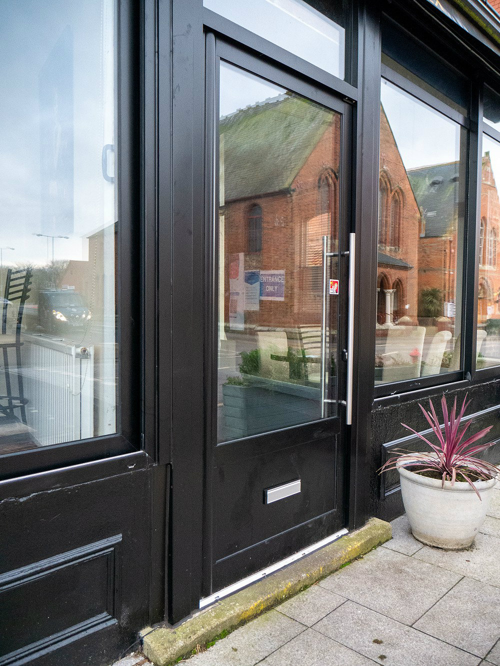 New aluminium front door on shop front