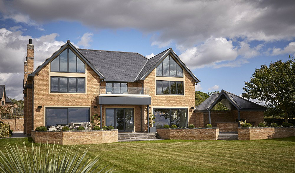 Larg detached house with aluminium windows and doors, and bifold doors