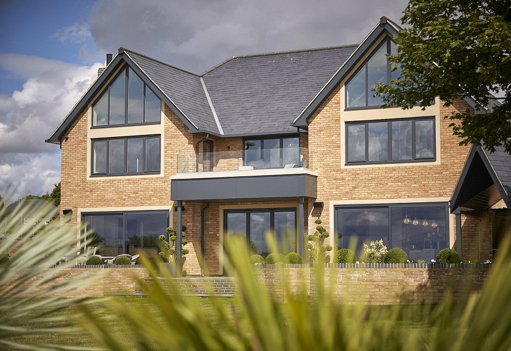 Bifold doors in graphite grey on large newbuild home