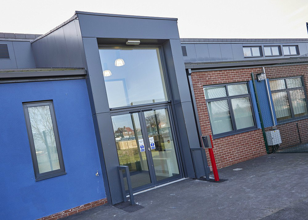 Striking entrance to a Hull school, which features aluminium doors and windows